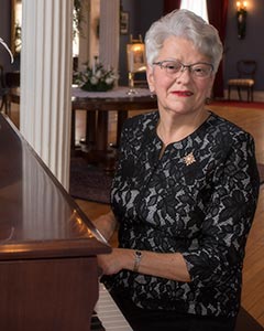 Her Honour, Antoinette Perry, Lieutenant Governor of Prince Edward Island, playing the grand piano at Government House