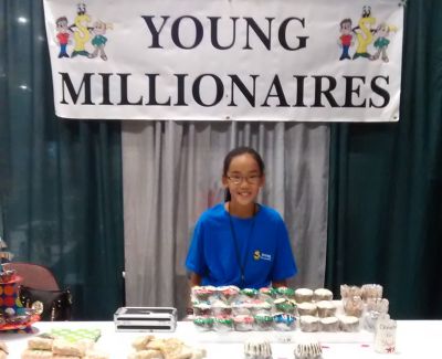 Olivia Lewis Olivia displayed her baked goods at a Young Millionaires event