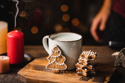 coffee mug next to a candle