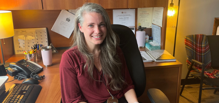 Photo of social worker seated at her desk