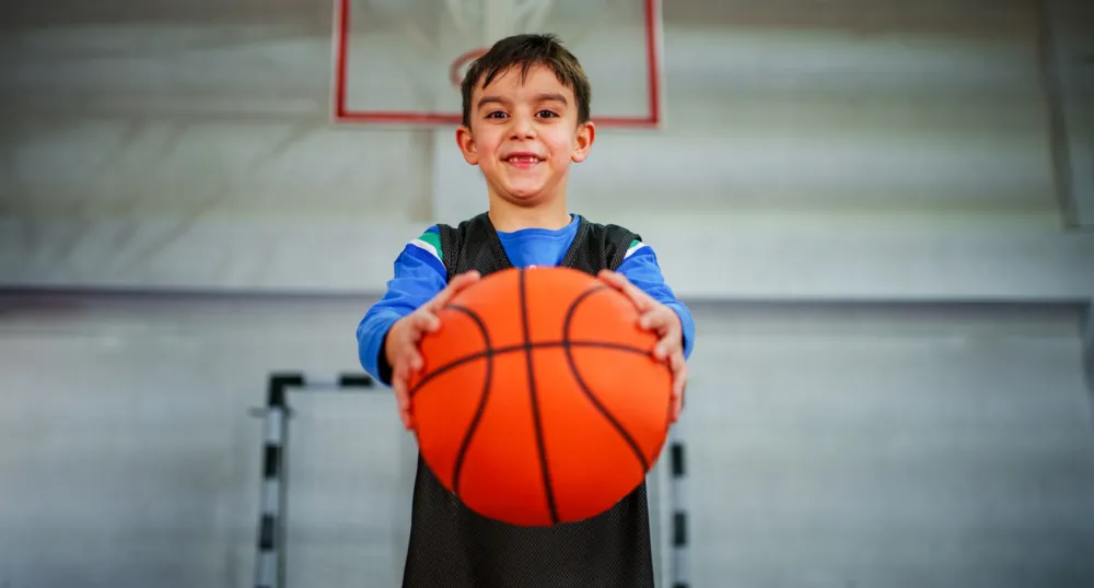 young boys playing basketball