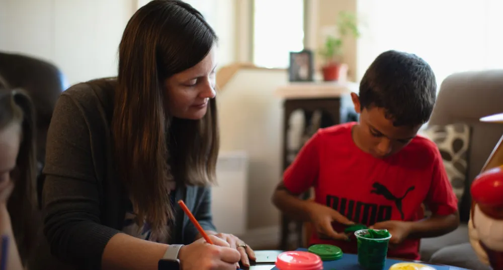 adult and child painting