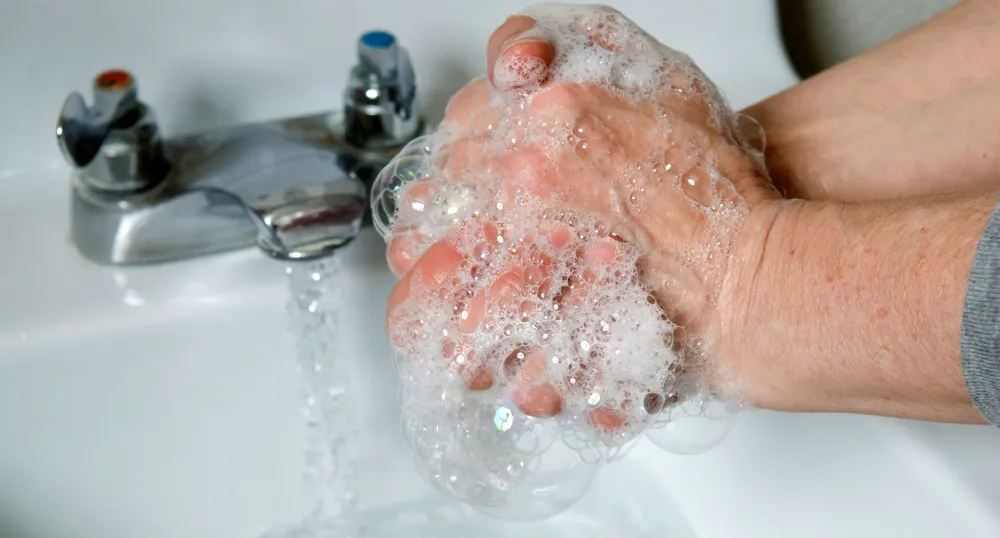 a person washing their hands