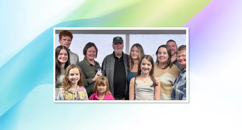 Surrounded by her family, Sue Doucette, provincial palliative home care clinical development coordinator and recipient of the King Charles III medal.