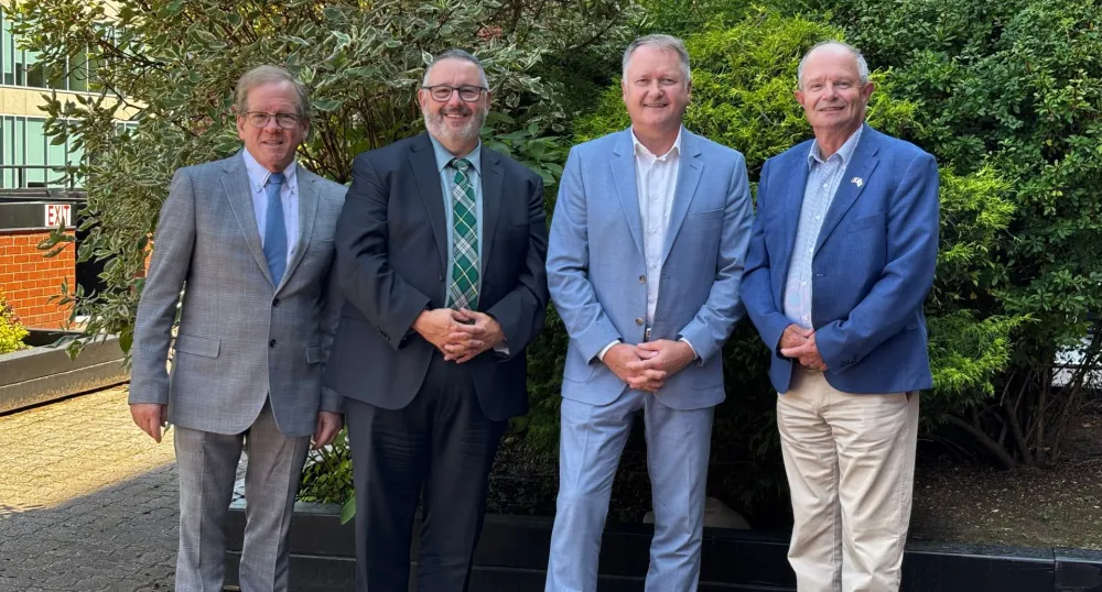 The four Atlantic Transportation Ministers stand next to each other outside.