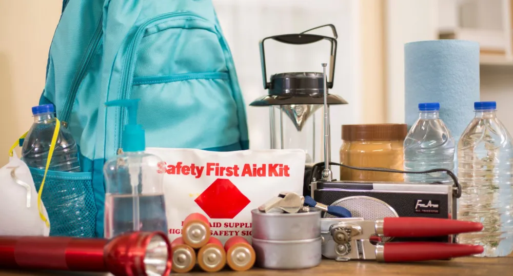 Emergency kit supplies such as backpack, lantern, batteries and first aid kit.