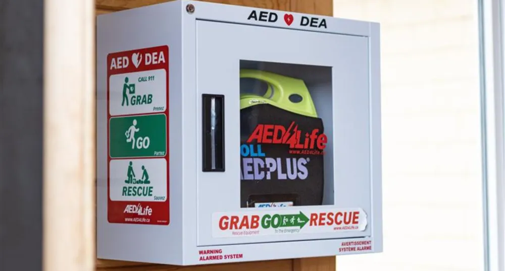 An Automated External Defibrillator (AED) on a wall.