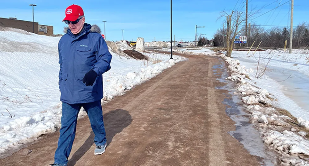 Leon Robinson walking on a trail