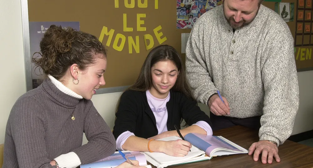 students looking at a book