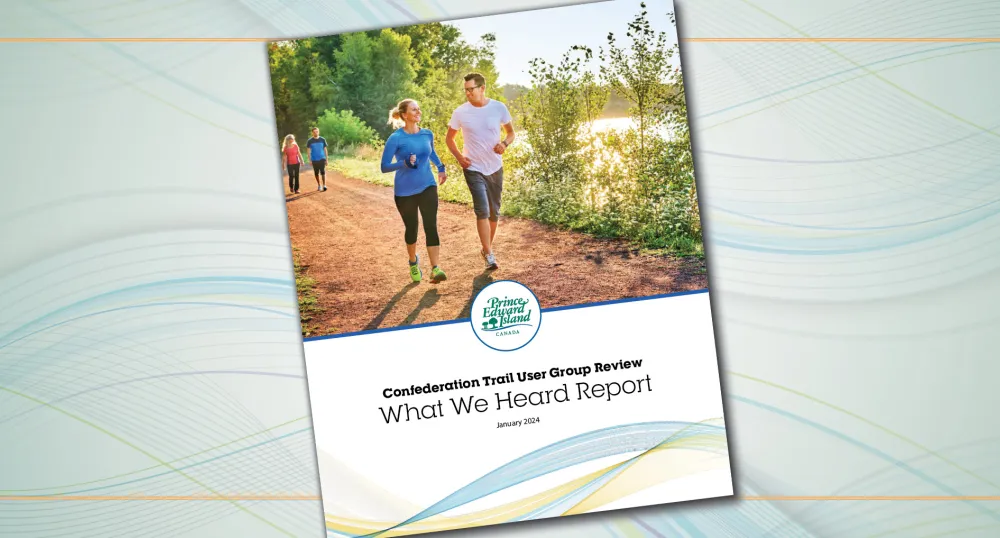 image of people outside walking on a trail by the water