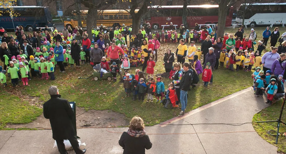 Minister Currie speaks to hundreds of children outside of the legislature.