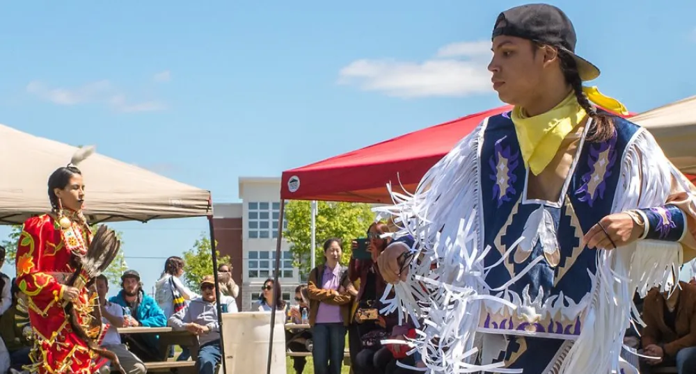 Image of traditional dancers at pow wow at Confederation Landing Park, Charlottetown PEI