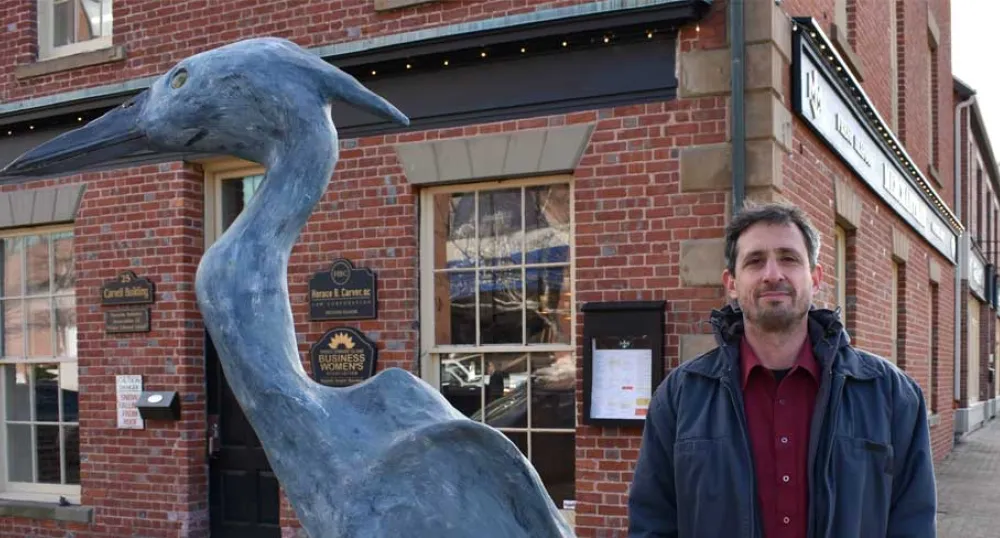 Ahmon Katz with his sculpture of a Blue Heron in Charlottetown