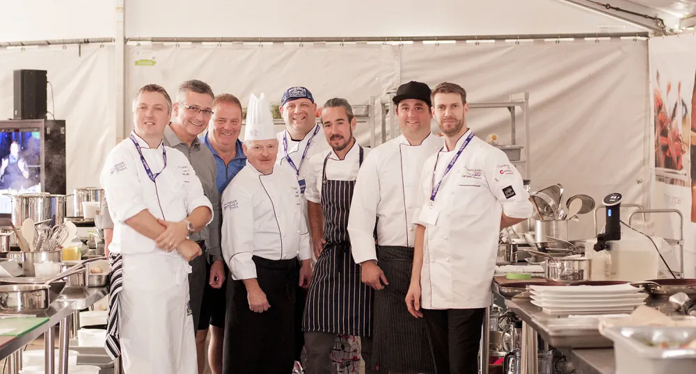 Group of six chefs standing at Chef's Challenge