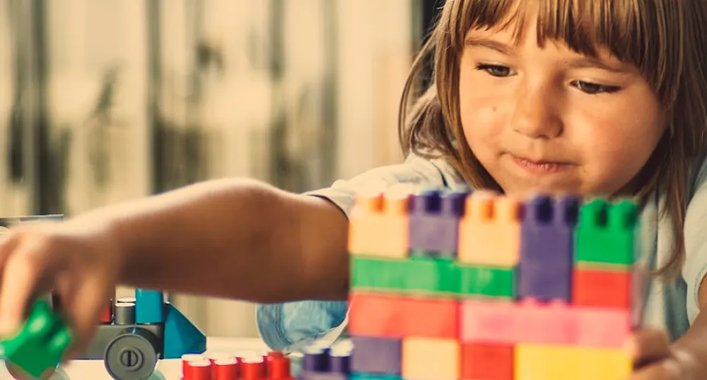 image of child playing with building blocks