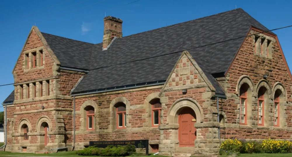 Photograph of the Kings County Courthouse with a blue sky in the background