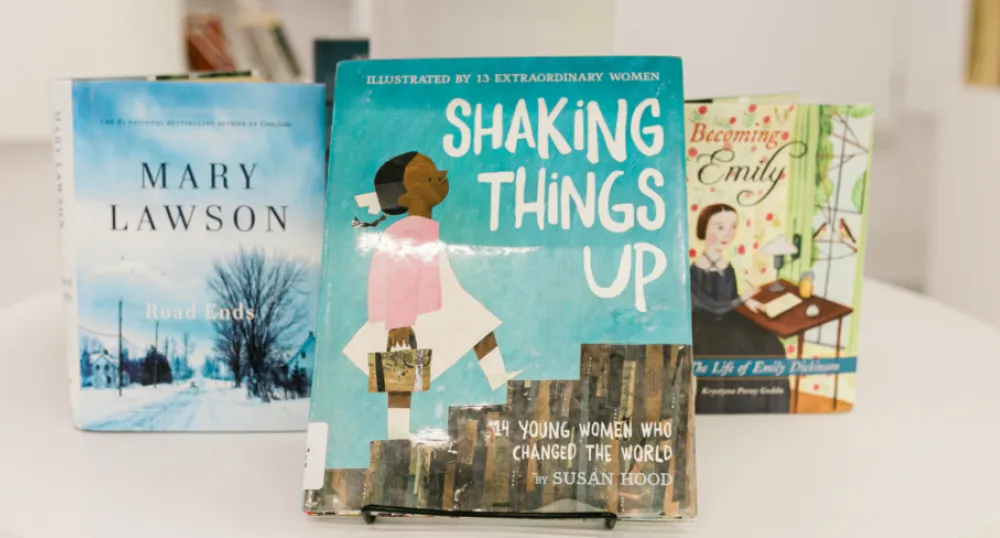 A library display of books featuring strong women