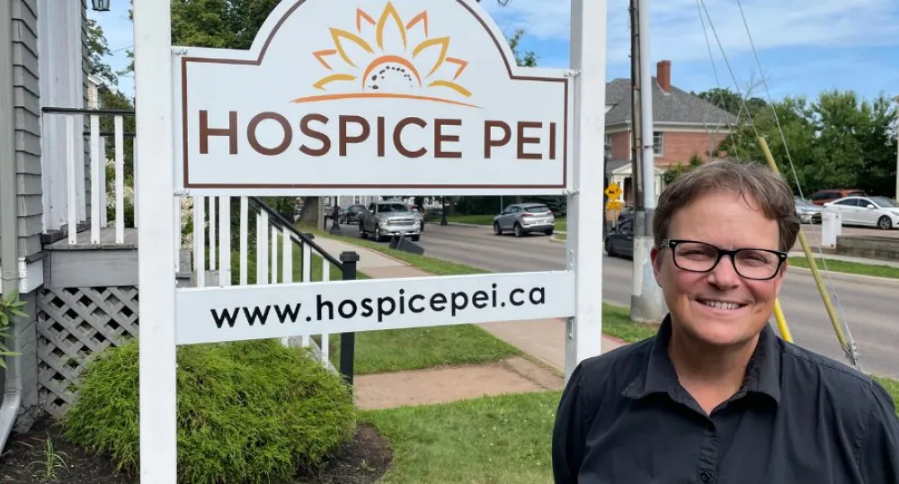 Woman in front of sign