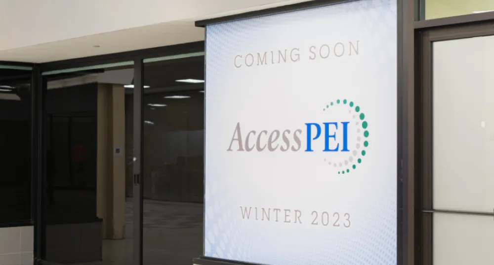 image of a  white sign in front of a mall storefront window