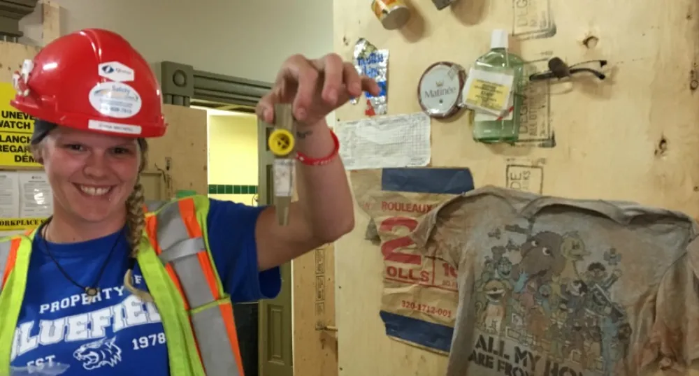 Jenna MacNeill, who is working on the renovations at Province House, displays some of the artifacts that the crew has been finding. 