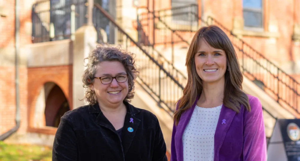 Image of 2 women wearing purple 