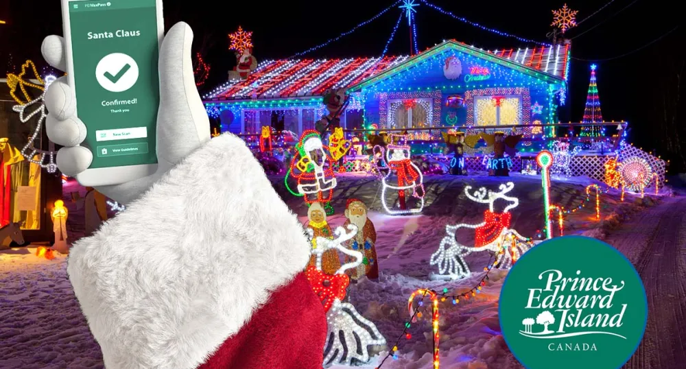 image of Santa holding his cellphone with a confirmed VaxPass message on it