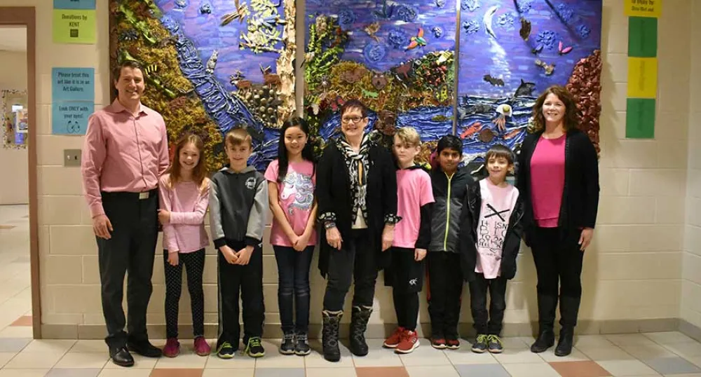Minister Jordan Brown with artist Dina Blot, West Royalty Elementary teacher Tracey Smith and students