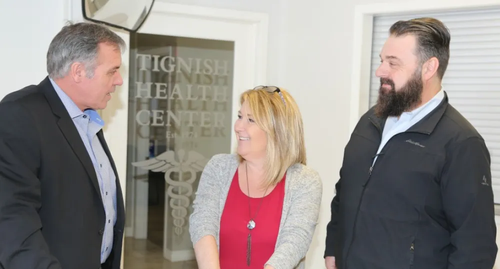 Minister Robert Mitchell, Tignish Health Centre manager Wendy Arsenault and MLA Hal Perry.