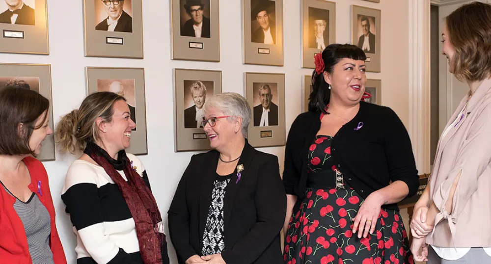 Photos shows Minister Paula Biggar in the middle of a group of five women.