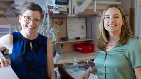 Dr. Brown and Dr. MacLean smile next to eachother.