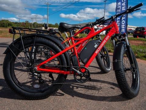image of two electric bicycles in a parking lot