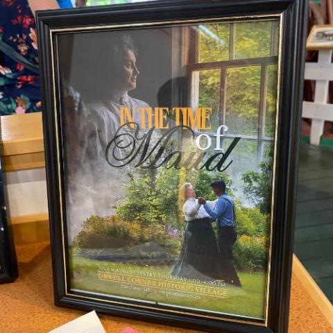 image of a framed photo on a table with a couple dancing in a meadow in the image