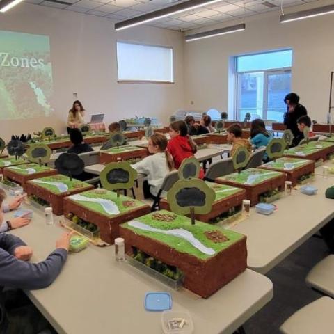 image of a teacher and students in a classroom