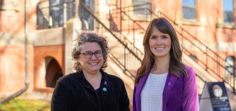 Image of 2 women wearing purple