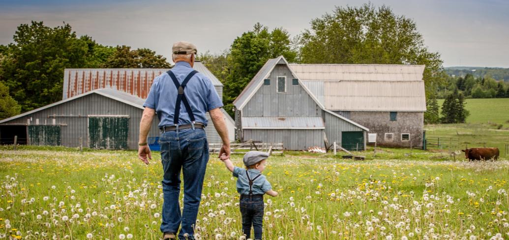 Photo contest winning photo shows farmer and young child walking towards a barn