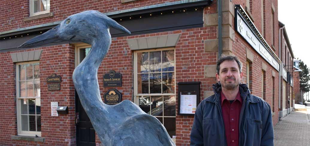 Ahmon Katz with his sculpture of a Blue Heron in Charlottetown