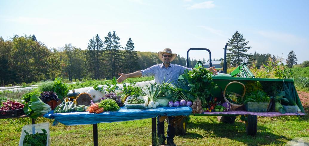 Farmer with display of produce