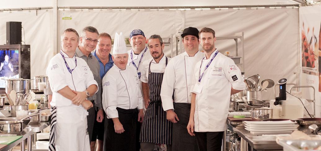 Group of six chefs standing at Chef's Challenge