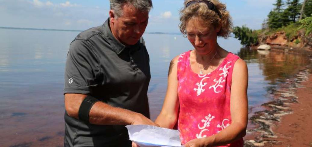 Communities, Land and Environment Minister Robert Mitchell and Megan Harris, Executive Director of the PEI Nature Trust on Courtin Island off Prince Edward Island