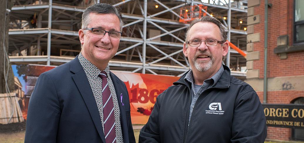 Minister Heath MacDonald stands with Sam Sanderson, general manager of the Construction Association of PEI