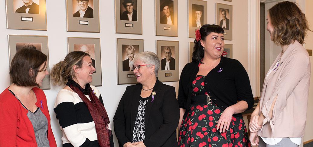 Photos shows Minister Paula Biggar in the middle of a group of five women.