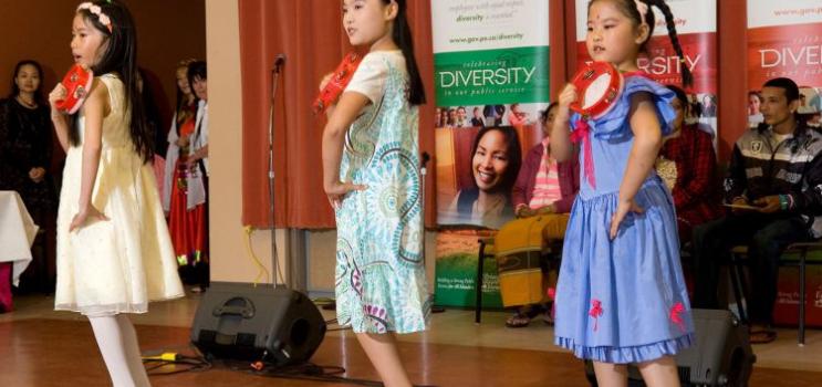 Young girls dance at a diversity festival 