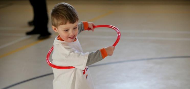 Boy playing with a hula hoop