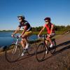 Male and female biking on Confederation Trail