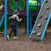 Image of young boy running in playground