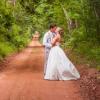 Newly weds on red dirt road of PEI