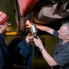 Apprentices learning about auto mechanics