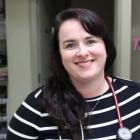 Nurse practitioner with a big smile in clinical setting on PEI
