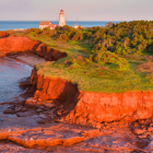 Image of red cliffs and lighthouse on Prince Edward Island