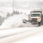 snow plow clearing a road